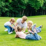 Happy family resting in park